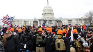 Members of the far-right group Proud Boys make ‘OK’ hand gestures indicating “white power” as supporters of U.S. President Donald Trump gather in front of the U.S. Capitol Building to protest against the certification of the 2020 U.S. presidential election results by the U.S. Congress, in Washington, U.S., January 6, 2021.