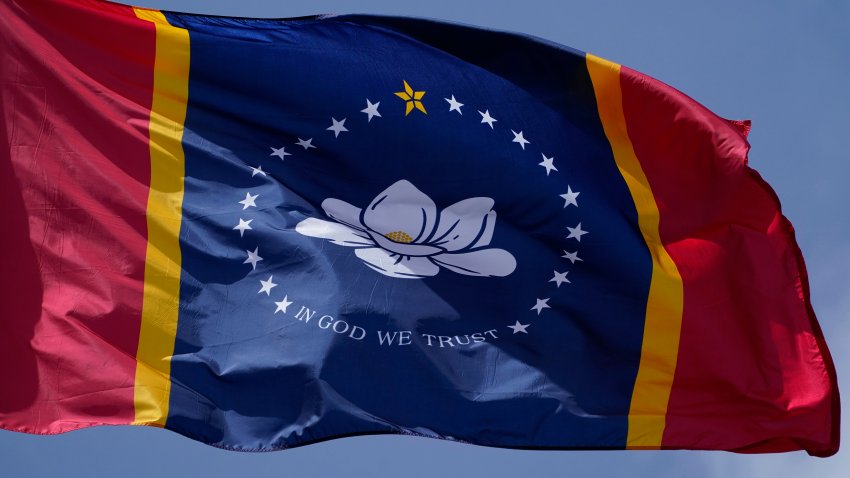 FILE - This Sept. 2, 2020, file photo shows the magnolia centered banner chosen by the Mississippi State Flag Commission displayed outside the Old State Capitol Museum in downtown Jackson, Miss. Voters approved the design in the general election on Tuesday, Nov. 3, 2020. It replaces a Confederate-themed flag state lawmakers retired in late June as part of the national reckoning over racial injustice.