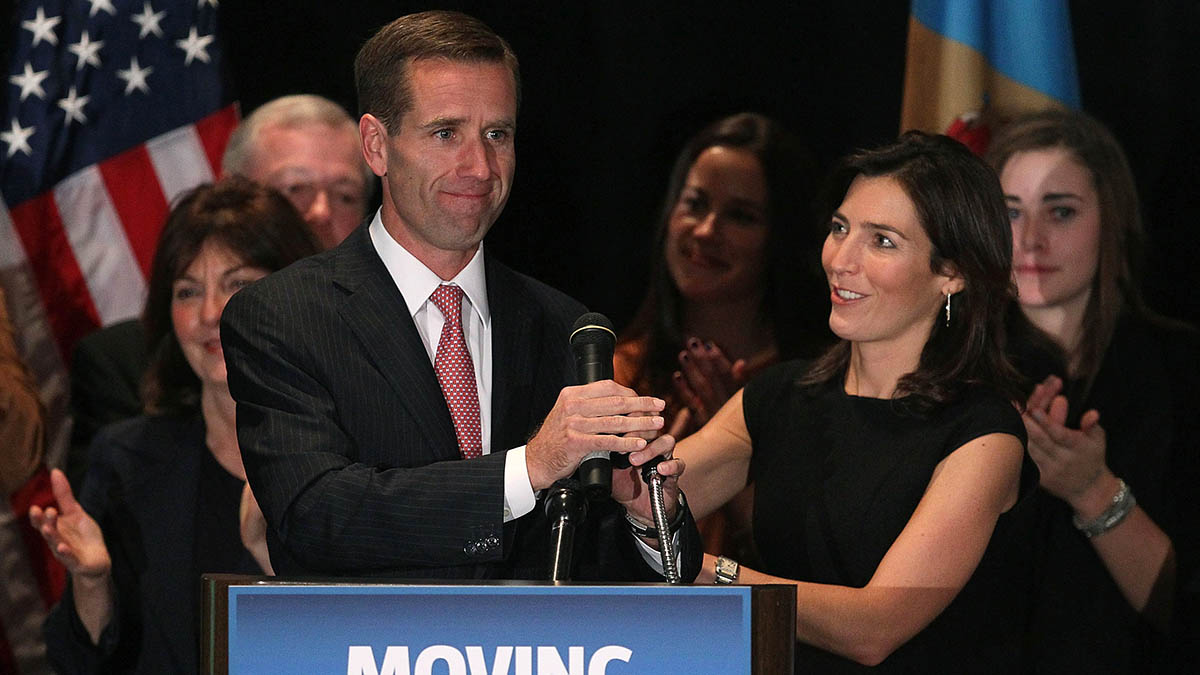 WILMINGTON, DE - NOVEMBER 02: Attorney General Beau Biden (L) celebrates his win with his wife Hallie Biden during a victory party for Democrats on November 2, 2010 in Wilmington, Delaware. Biden won in his re-election bid for Delaware Attorney General against Independent candidate Doug Campbell.   (Photo by Mark Wilson/Getty Images)