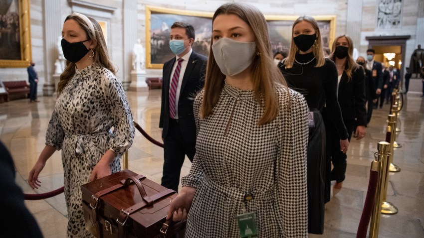 Chamber Assistants carry Electoral College ballot boxes