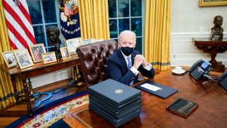 Joe Biden at his desk in the Oval Office