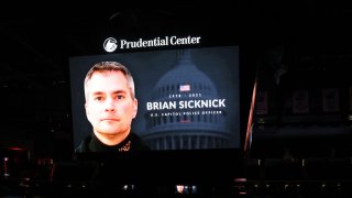 The New Jersey Devils honor slain Capitol police officer and New Jersey native Brian Sicknick before the game between the New Jersey Devils and the Boston Bruins during the home opening game at Prudential Center on January 14, 2021 in Newark, New Jersey