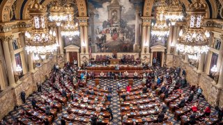 One fourth of the Pennsylvania House of Representatives is sworn-in, Tuesday, Jan. 5, 2021, at the state Capitol in Harrisburg, Pa. The ceremony was held in four separate sessions to provide for social distancing due to COVID-19. The ceremony marks the convening of the 2021-2022 legislative session of the General Assembly of Pennsylvania.