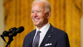 President Joe Biden arrives to deliver remarks as he takes part in a Munich Security Conference virtual event from the East Room at the White House in Washington, February 19, 2021.