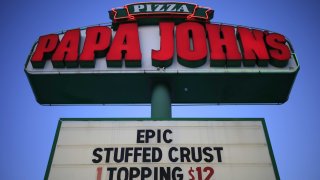 Signage outside a Papa John’s International pizza restaurant in Louisville, Kentucky, on Monday, Feb. 22, 2021.