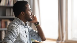 A man talks on the phone