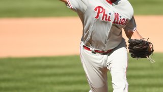 Jared Hughes throws a pitch in a Phillies uniform
