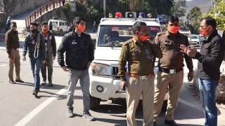 Police personnel prepare in Srinagar of Uttarakhand state on February 7, 2021 after a glacier broke off in Chamoli district causing flash floods in the Dhauli Ganga river.