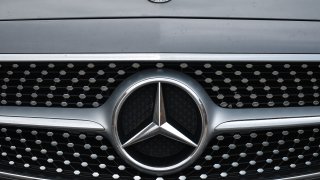 a logo of Mercedes-Benz