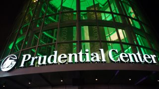Prudential Center sign in front of green
