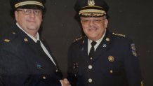 The late Capt. Frank Milillo (left) shakes hands with former Philadelphia Police Commissioner Charles Ramsey.