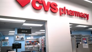 A pharmacist works at the CVS pharmacy at Target in the Tenleytown area of Washington, March 17, 2020.