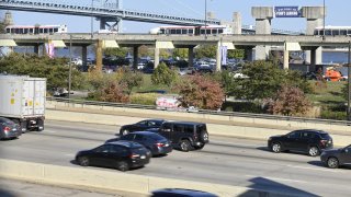 Traffic on the I-95 rolls past Penns Landing, in Philadelphia, PA,