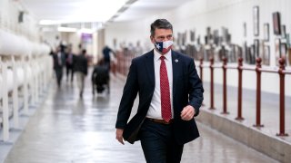 WASHINGTON, DC - JANUARY 12: Rep. Ronny Jackson (R-TX) wears a protective mask while walking through the Canon Tunnel to the U.S. Capitol on January 12, 2021 in Washington, DC. Today the House of Representatives plans to vote on Rep. Jamie Raskin's (D-MD) resolution calling on Vice President Mike Pence to invoke the 25th Amendment, removing President Trump from office. On Wednesday, House Democrats plan on voting on articles of impeachment.