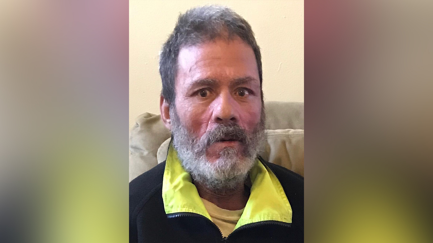 Roberto Oquendo Velez is seen in a black shirt with yellow collar