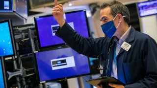 A trader works on the floor of the New York Stock Exchange.