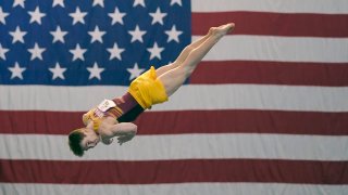 Michael Moran, representing the University of Minnesota, competes during the Winter Cup gymnastics event