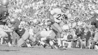 Purdue's Leroy Keyes carrying football in black and white photo