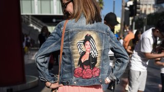 A Selena Quintanilla fan showing off the back of her jean jacket with Selena's image