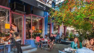 Patrons dine at tables outside Sabrina's Café in South Philadelphia