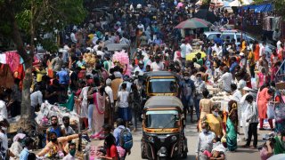 Crowds of people are seen shopping during a weekly market at Kandivali.