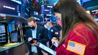 Traders on the floor of the New York Stock Exchange.