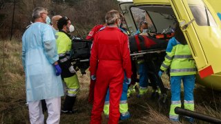 The emergency services attend to a man who has suffered a stroke in Madrid, Spain.
