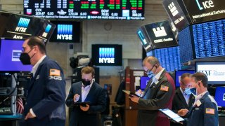 Traders work on the floor of the New York Stock Exchange.