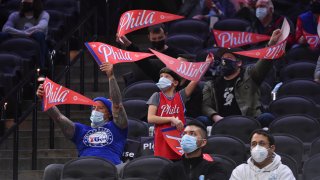 Philadelphia 76ers fans celebrate during a game on March 16, 2021 at Wells Fargo Center in Philadelphia, Pennsylvania.