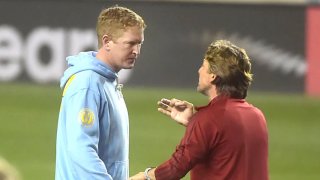 Atlanta coach Gabriel Heinze seems unhappy as he talks with Union coach Jim Curtin following the game.