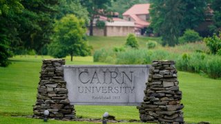 A sign for Cairn University is displayed at the campus in Langhorne, Pa., Friday, June 4, 2021. The Christian university outside of Philadelphia has shuttered its highly-regarded social work degree program partly because university officials said the national accrediting agency was attempting to impose values regarding sexuality and gender that did not align with the university’s religious mission. (AP Photo/Matt Rourke)