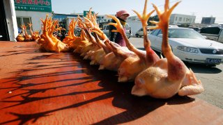 slaughtered chickens are displayed for sale at a wholesale poultry market in Shanghai.