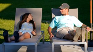 Cecilia Shaffette relaxes in the backyard with her father Rhett Shaffette, at their home in Carriere, Miss., Wednesday, June 16, 2021. The 12-year-old is thriving, eight months after getting a portion of her father's liver. She received the transplant after nearly losing her life to internal bleeding.