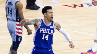 Philadelphia 76ers player Danny Green pumps his fist as he celebrates.