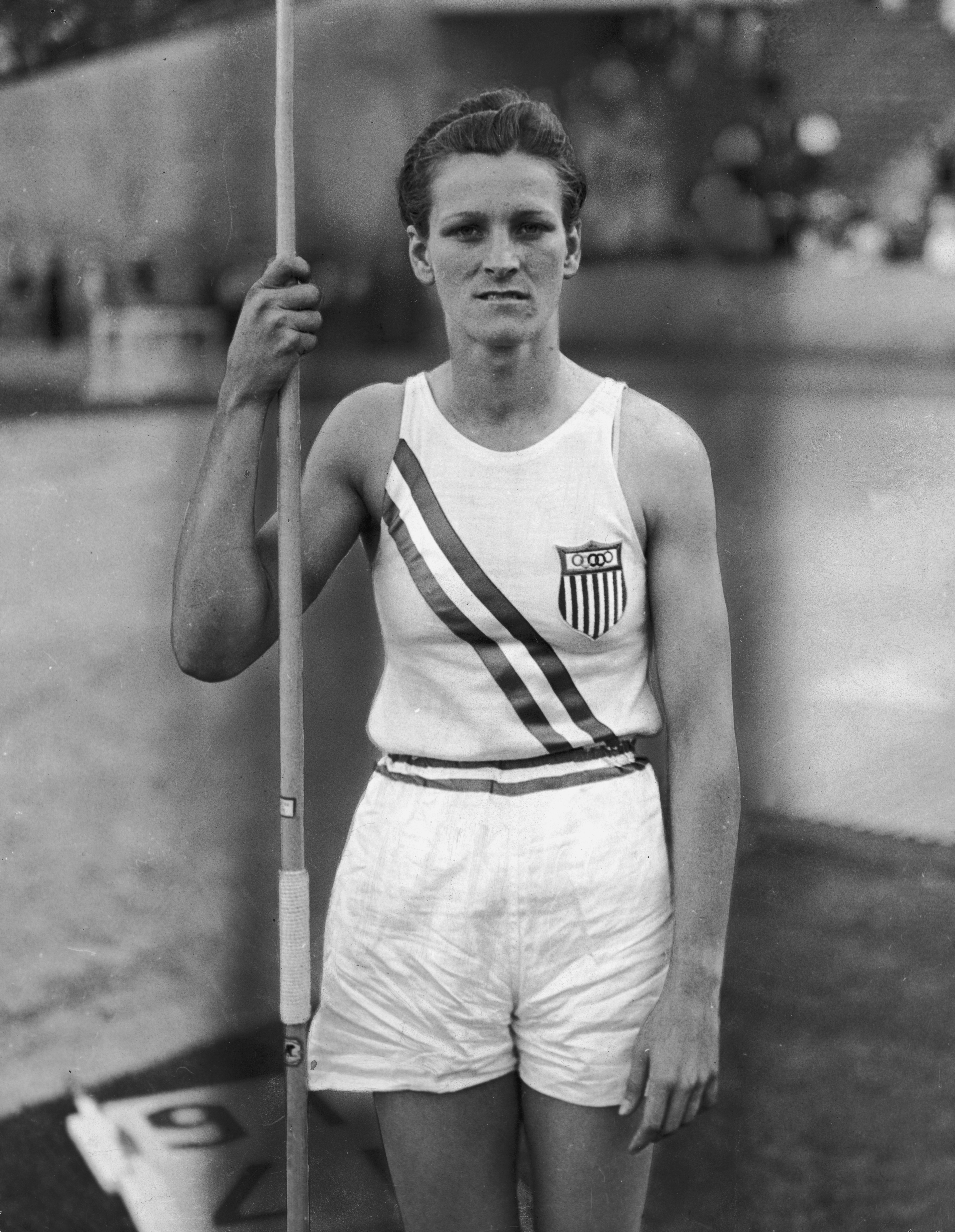 Portrait of American athlete Babe Didrikson Zaharias in 1932 holding a javelin and wearing her Olympic uniform in Los Angeles, California. Babe set a new world record with her javelin throw at the event.