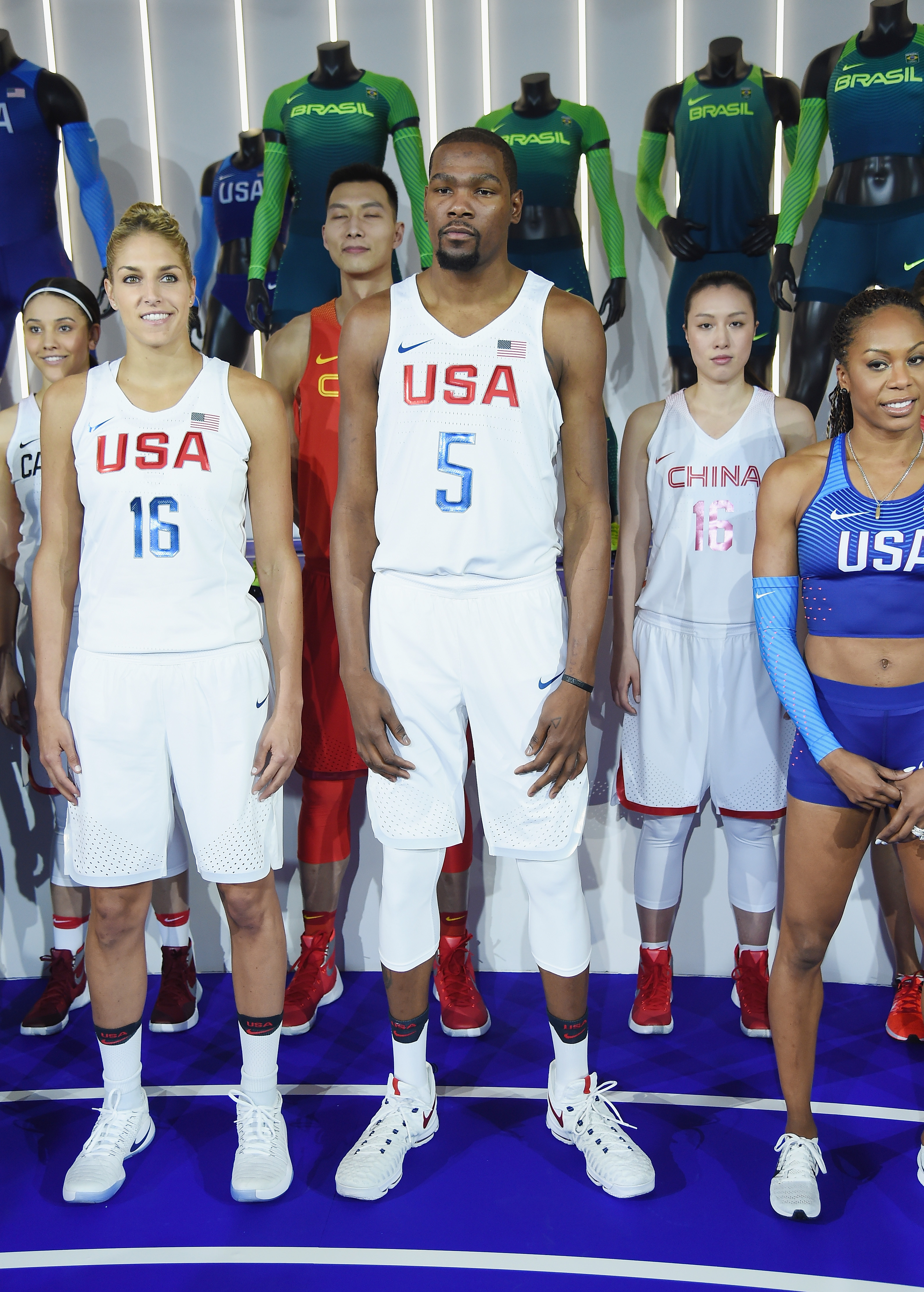 Professional basketball players Elena Delle Donne, Kevin Durant, and Sanya Richards-Ross show off the 2016 Olympics Uniforms For USA on March 17, 2016, in New York City.