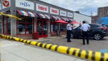 Philadelphia police officers outside the roped off Federal Donuts location