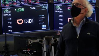 Traders work during the IPO for Chinese ride-hailing company Didi Global Inc on the New York Stock Exchange (NYSE) floor in New York City, U.S., June 30, 2021.