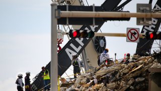 Team of rescue workers are seen during a rescue operation of Champlain Tower partially collapsed in Surfside, Florida, on July 02, 2021.