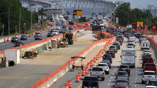 Heavy outgoing traffic moves toward the Chesapeake Bay Bridge on the eve of Memorial Day long weekend May 28, 2021, in Annapolis, Maryland.