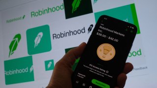 A person looking at a smartphone with the projected Robinhood price shares in Los Angeles, July 27, 2021.