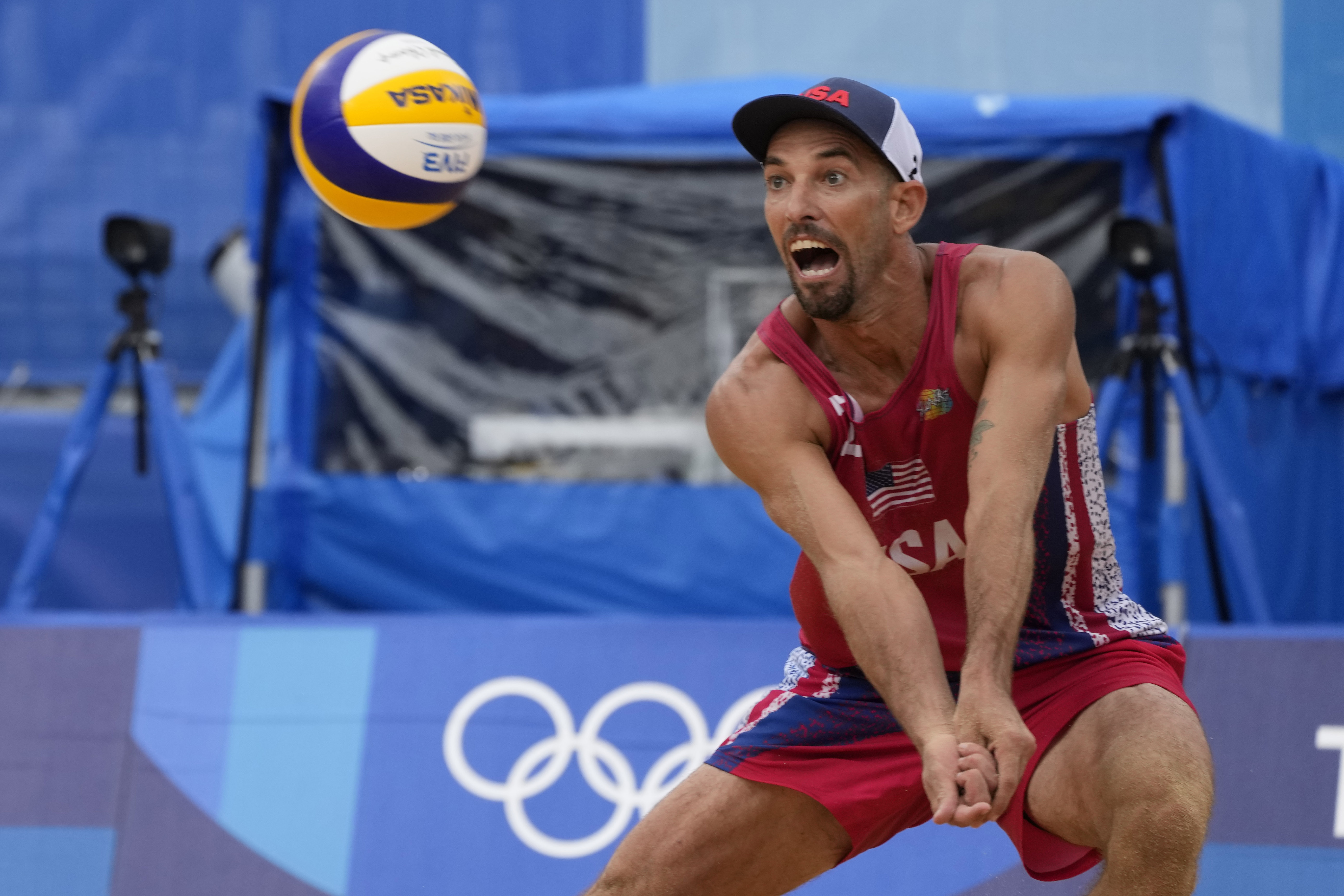 Nicholas Lucena, of the United States, returns a shot during a men's beach volleyball match against Brazil at the 2020 Summer Olympics, Tuesday, July 27, 2021, in Tokyo, Japan.