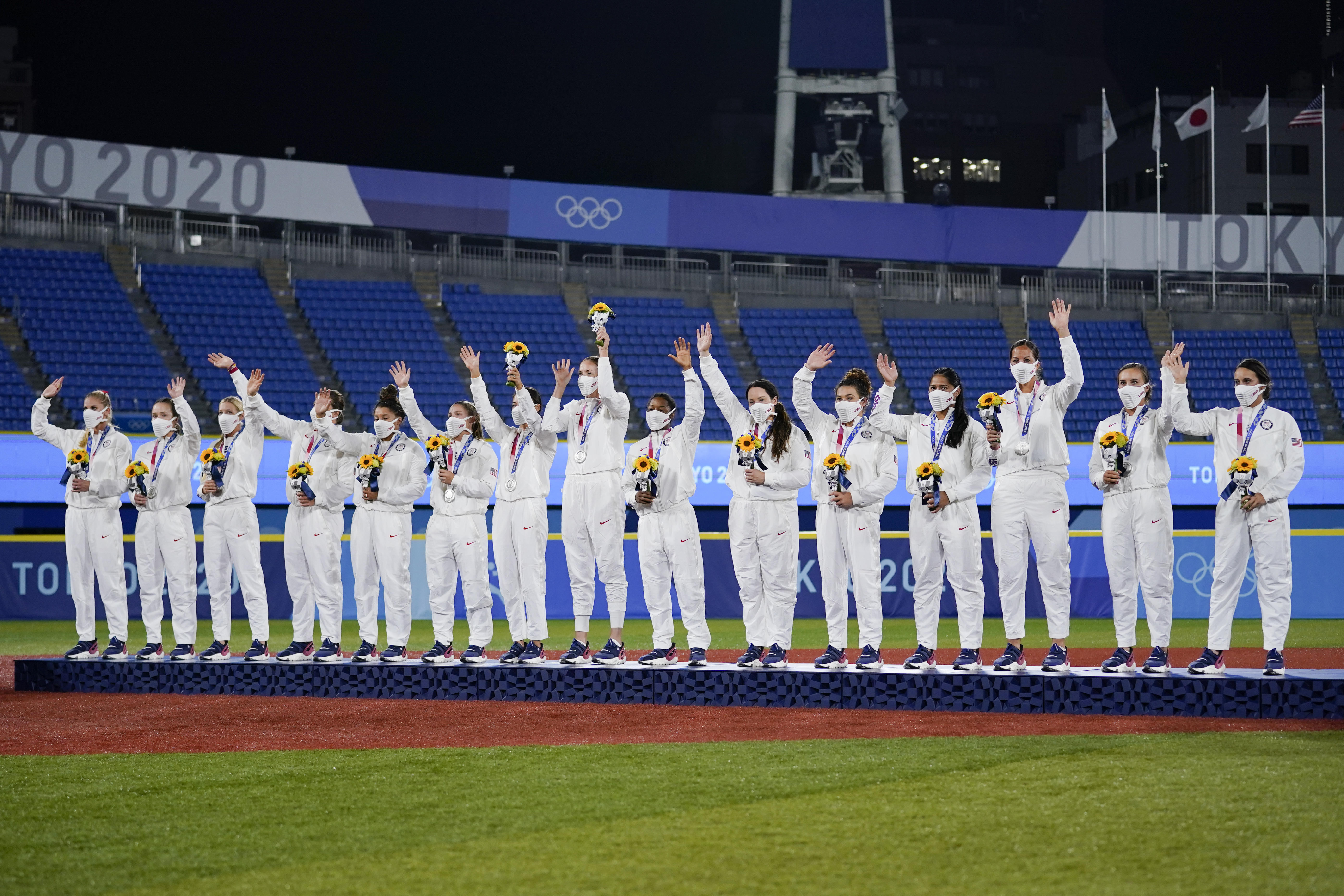 Silver medalist team United States celebrate on the podium during the medal ceremony for softball at the at the 2020 Summer Olympics, Tuesday, July 27, 2021, in Yokohama, Japan.