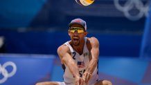 Nicholas Lucena, of the United States, competes during a men's beach volleyball match