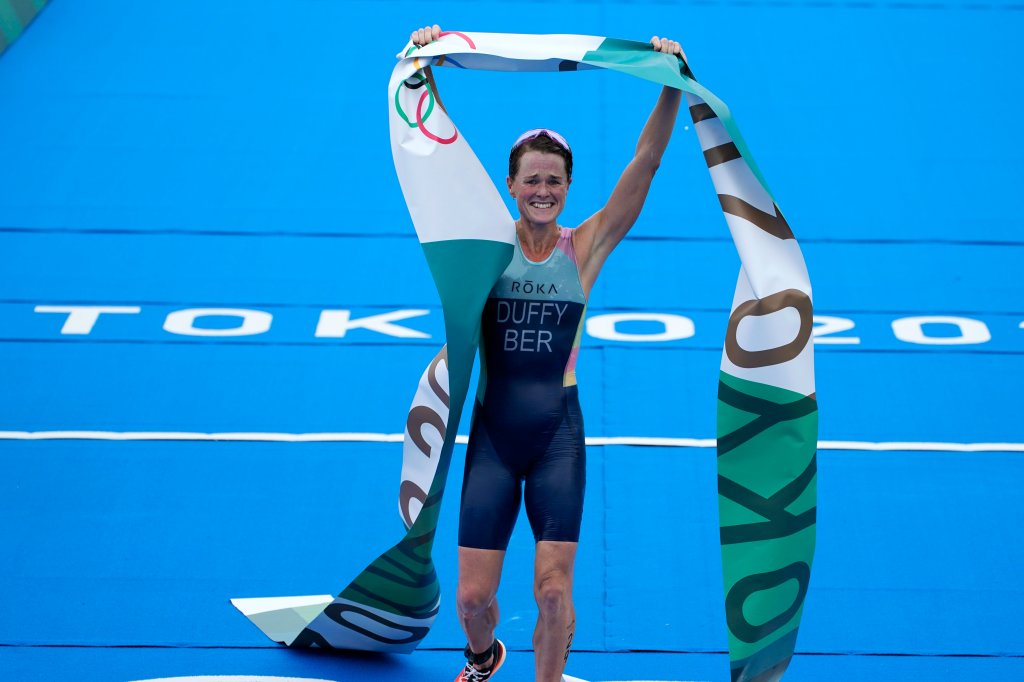 Flora Duffy of Bermuda celebrates after crossing the finish line to win the gold medal in the women's individual triathlon competition at the 2020 Olympics on July 27, 2021, in Tokyo, Japan.