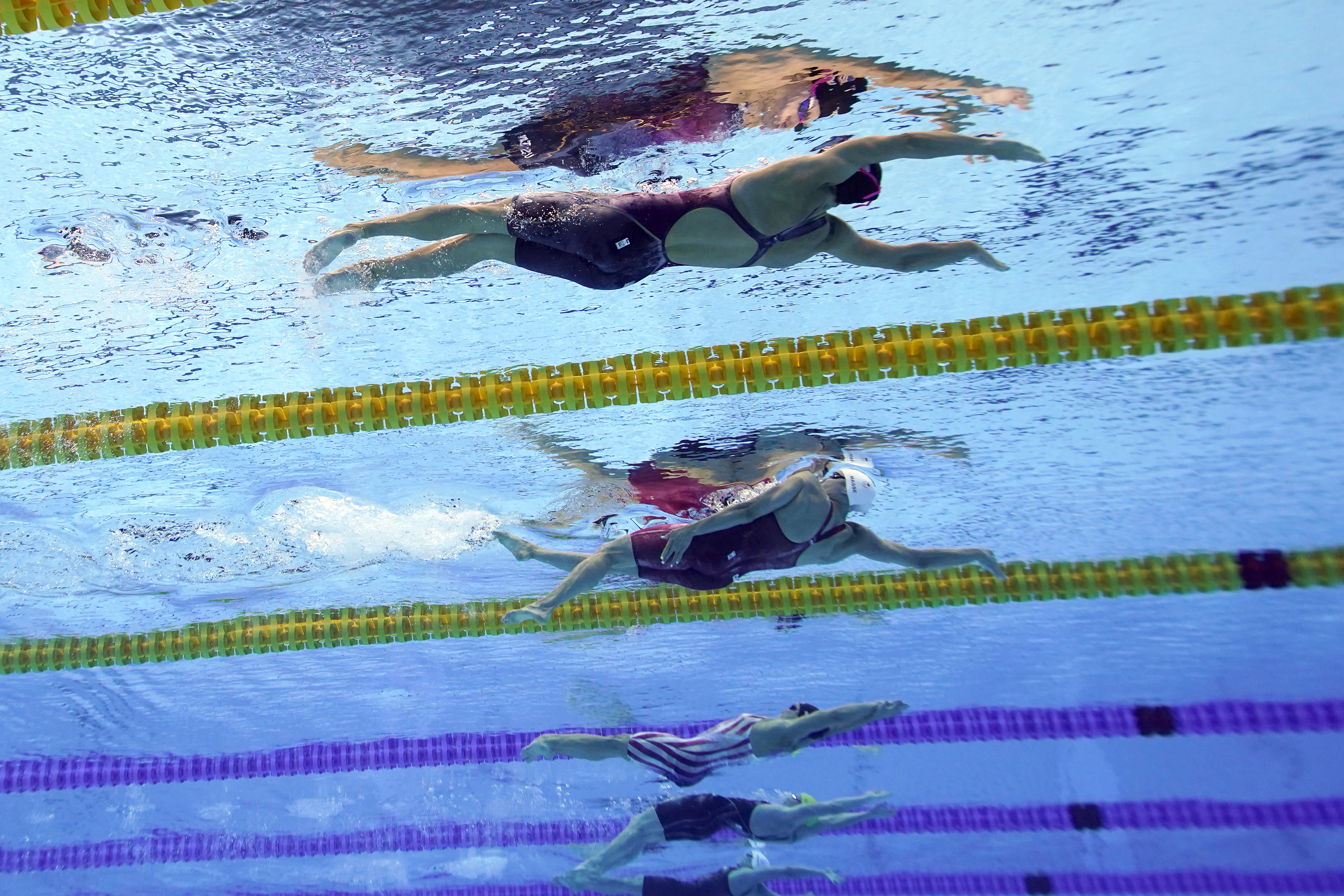 United States' Regan Smith, top, swims to win the bronze medal in the 100-meter backstroke final at the 2020 Olympics on July 27, 2021, in Tokyo.