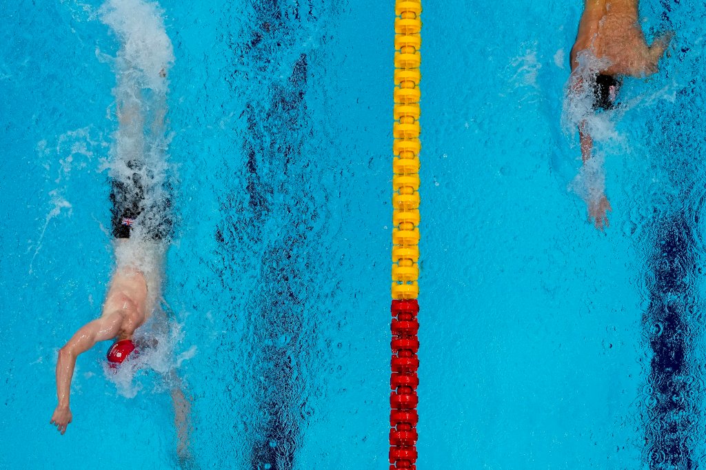Tom Dean, of Britain and Kieran Smith, of the United States swim in the final of the men's 200-meter freestyle at the 2020 Olympics on July 27, 2021, in Tokyo, Japan.