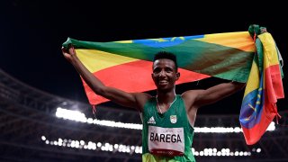 Ethiopia's Selemon Barega celebrates after winning the men's 10000m final during the Tokyo 2020 Olympic Games 