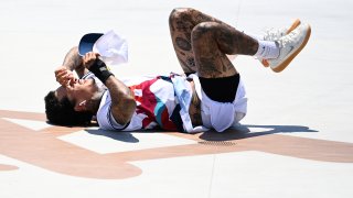 Nyjah Huston wipes out at the mens skateboarding street final at Aomi Urban Sports Park, Tokyo, July 25, 2021.