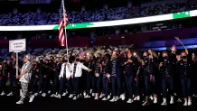 Flag bearers Sue Bird and Eddy Alvarez of Team United States lead their team out during the Opening Ceremony of the Tokyo 2020 Olympic Games at Olympic Stadium on July 23, 2021 in Tokyo, Japan.